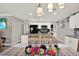 Bright kitchen with a gray backsplash, stainless appliances, white cabinets and granite countertops at 3060 55Th N Ave, St Petersburg, FL 33714