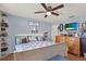 Inviting main bedroom with a comfortable bed, dresser, TV, decorative shelves, and ceiling fan at 3060 55Th N Ave, St Petersburg, FL 33714