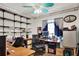 Functional home office with multiple desks, shelving, and a window for natural light at 3060 55Th N Ave, St Petersburg, FL 33714