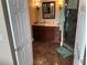 Bathroom features a walk-in shower, dark wood vanity, marble countertop and bronze fixtures at 324 6Th Ave, Indian Rocks Beach, FL 33785