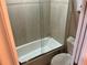 Bright bathroom features a tiled shower and tub combination with glass enclosure at 324 6Th Ave, Indian Rocks Beach, FL 33785