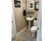 Small bathroom with pedestal sink, toilet and decor at 324 6Th Ave, Indian Rocks Beach, FL 33785
