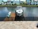 Waterfront property with boat dock, featuring boat lift, and views of the canal at 324 6Th Ave, Indian Rocks Beach, FL 33785