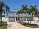 Charming two-story home with a 3-car garage, and a brick paved driveway at 324 6Th Ave, Indian Rocks Beach, FL 33785