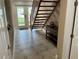 Light and airy foyer with tiled floors and staircase at 324 6Th Ave, Indian Rocks Beach, FL 33785
