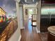 Hallway with hardwood flooring, neutral wall colors, and a view of the staircase and outdoor area at 324 6Th Ave, Indian Rocks Beach, FL 33785