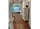 Hallway leading to a bedroom with a white dresser at 324 6Th Ave, Indian Rocks Beach, FL 33785