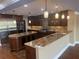 Gourmet kitchen with granite counters, stainless steel appliances, and custom cabinetry at 324 6Th Ave, Indian Rocks Beach, FL 33785