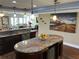 Bright, modern kitchen with an island, stainless steel appliances, and view to living room at 324 6Th Ave, Indian Rocks Beach, FL 33785
