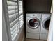 Bright laundry area with large window and modern washer and dryer for added convenience at 324 6Th Ave, Indian Rocks Beach, FL 33785