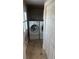 Laundry room with front-load washer and dryer and built-in cabinets at 324 6Th Ave, Indian Rocks Beach, FL 33785