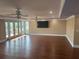 Open living room featuring hardwood floors, recessed lighting and large windows at 324 6Th Ave, Indian Rocks Beach, FL 33785