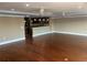 Spacious living room boasts hardwood floors and an open-concept design to the kitchen at 324 6Th Ave, Indian Rocks Beach, FL 33785
