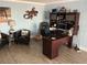 Bright home office with a large desk, shelves, decor, and dog bed at 324 6Th Ave, Indian Rocks Beach, FL 33785