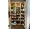 Well-organized walk-in pantry with custom shelves and ample storage for groceries and kitchen essentials at 324 6Th Ave, Indian Rocks Beach, FL 33785