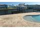 Waterfront pool featuring boat lift and waterfront views, set in a coastal neighborhood at 324 6Th Ave, Indian Rocks Beach, FL 33785