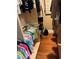 Walk-in closet with rods and shelves for organizing clothes and shoes at 324 6Th Ave, Indian Rocks Beach, FL 33785