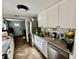Modern kitchen showcasing granite countertops, stainless steel appliances, and white cabinetry at 3970 56Th Ave N, St Petersburg, FL 33714