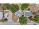 Aerial view of a home with a fenced backyard, shed, and trampoline at 4017 Moog Rd, Holiday, FL 34691