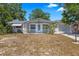 Charming single-story home with an attached garage, tidy landscaping, and a well-manicured lawn at 4017 Moog Rd, Holiday, FL 34691