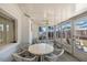 Sunroom with white patio furniture, lots of windows and light at 4017 Moog Rd, Holiday, FL 34691