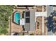 Aerial view of house with solar panels and screened in pool at 4018 Highgate Dr, Valrico, FL 33594