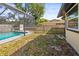 View of backyard with screened pool and a secure fenced perimeter at 4018 Highgate Dr, Valrico, FL 33594