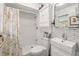 Bathroom with a modern tiled shower, floating vanity, toilet, and mirror at 4018 Highgate Dr, Valrico, FL 33594