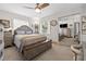 Bedroom featuring a ceiling fan, mirrored closet, and decor at 4018 Highgate Dr, Valrico, FL 33594