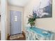 Cozy entryway with decorative cabinet and artwork, leading into the main living area at 4018 Highgate Dr, Valrico, FL 33594