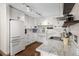 Bright kitchen featuring white cabinets, stainless steel appliances, and granite countertops at 4018 Highgate Dr, Valrico, FL 33594