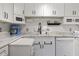 Modern kitchen featuring white cabinets, granite countertops and stainless steel appliances at 4018 Highgate Dr, Valrico, FL 33594