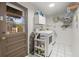 Functional laundry room with modern washer and dryer at 4018 Highgate Dr, Valrico, FL 33594