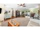 Spacious living room with wood floors and sliding glass doors to the pool at 4018 Highgate Dr, Valrico, FL 33594