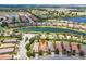 Beautiful aerial view of the home, lake and surrounding community with well-manicured landscaping at 4610 Alexandria Ct, Palmetto, FL 34221