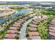 Aerial view of homes in a lakeside community boasting a scenic view of green landscaping and lakes at 4610 Alexandria Ct, Palmetto, FL 34221
