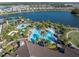 Expansive lakefront community featuring a resort-style pool, tennis courts, and lush landscaping at 4610 Alexandria Ct, Palmetto, FL 34221