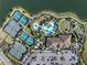 Community aerial view showcasing multiple tennis courts, resort-style pool, and ample parking at 4610 Alexandria Ct, Palmetto, FL 34221