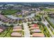 Aerial view showing the property in relation to the community with bodies of water and landscaping at 4610 Alexandria Ct, Palmetto, FL 34221