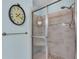 Bathroom with glass shower, decorative tile, and neutral tones, offering a clean and modern space at 4610 Alexandria Ct, Palmetto, FL 34221