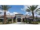 Stunning exterior of the community center, lined with palm trees and lush landscaping at 4610 Alexandria Ct, Palmetto, FL 34221