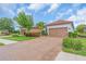 Exterior shot showcasing a well-maintained home with a tile roof and a brick driveway at 4610 Alexandria Ct, Palmetto, FL 34221