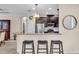 Modern kitchen with stainless steel appliances, granite countertops, and bar stool seating at the breakfast bar at 4610 Alexandria Ct, Palmetto, FL 34221