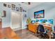 Home office with hardwood flooring, a large desk, and built-in shelves, perfect for working from home at 4610 Alexandria Ct, Palmetto, FL 34221