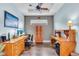 Dedicated home office with hardwood floors, a tray ceiling, ample desk space, and neutral wall colors at 4610 Alexandria Ct, Palmetto, FL 34221