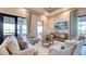 Inviting sitting area with comfortable seating, TV, and large windows at 4610 Alexandria Ct, Palmetto, FL 34221