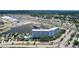 Aerial view of condo building on a waterfront, featuring a private marina, boat slips, and waterfront amenities at 4939 Floramar Ter # 504, New Port Richey, FL 34652