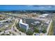 Aerial view of condo building on a waterfront with private marina, boat slips, and convenient highway access at 4939 Floramar Ter # 504, New Port Richey, FL 34652