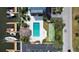 Aerial view of a community pool, shuffleboard court, boat docks, and manicured landscaping at 4939 Floramar Ter # 504, New Port Richey, FL 34652