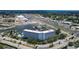 Aerial view of condo building with marina and boat slips, water access, adjacent highway, and nearby shopping at 4939 Floramar Ter # 504, New Port Richey, FL 34652